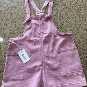 Zenana Women's Short Overalls in Soft Pink. Adjustable knotted straps.